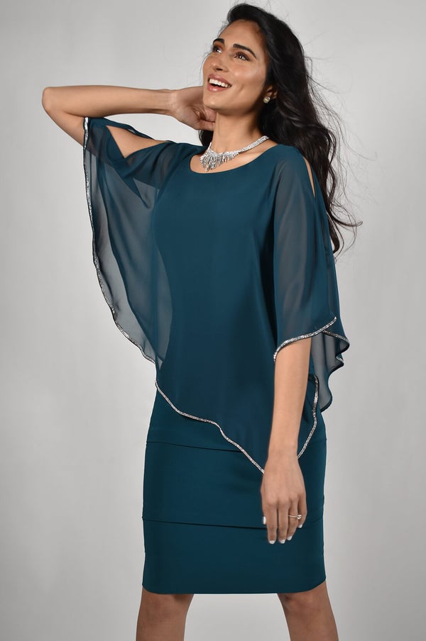 An elegant cocktail dress with tucking treatment at the skirt with a chiffon overlay trimmed with rhinestones.