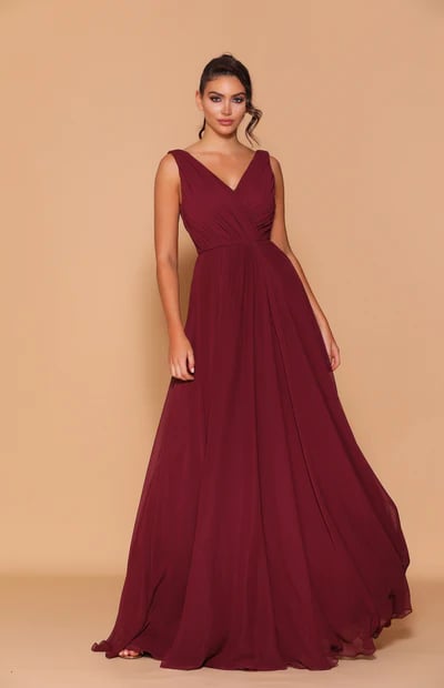 This beautiful gown features a V-neck front and back with a gathered bodice.