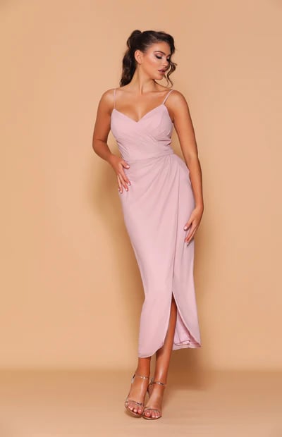 A beautiful mid-length side split dress featuring a sweetheart neckline with thin spaghetti straps.