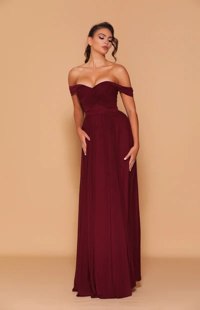 A classic full-length dress, featuring an off-shoulder, sweetheart neckline with a low back detailing