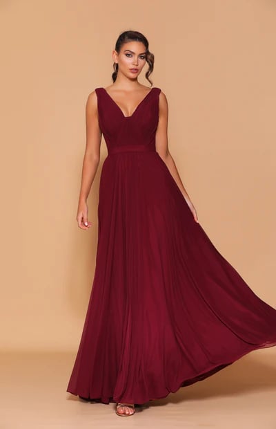 A classic full-length dress, featuring an off-shoulder, sweetheart neckline with a low back detailing