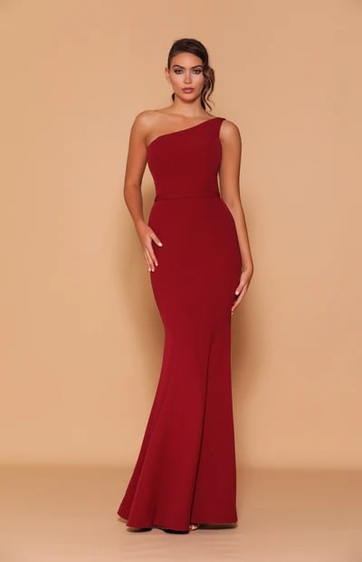 A stunning one-shouldered neckline gown. This form-fitting mermaid style dress is cinched in at the waist with a waistband.