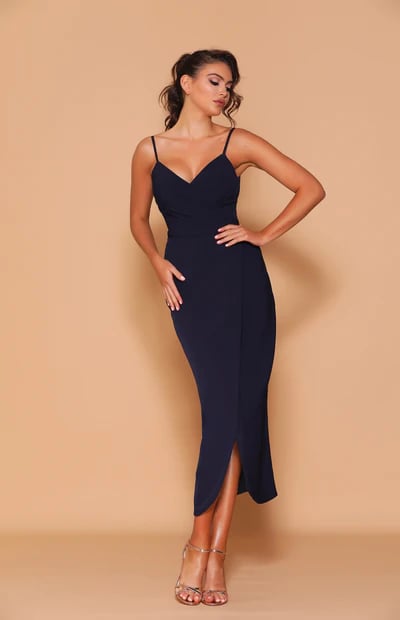 A lovely mid-length fully lined dress that features a V-neckline with pleated detailing along the bodice.