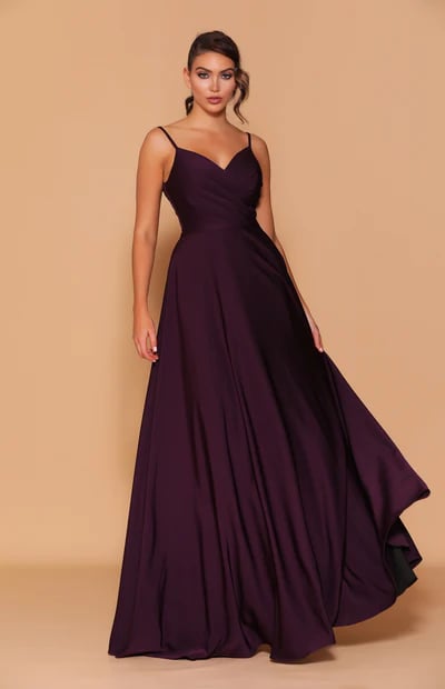 An elegant full-length gown featuring a crossover detailed bodice.