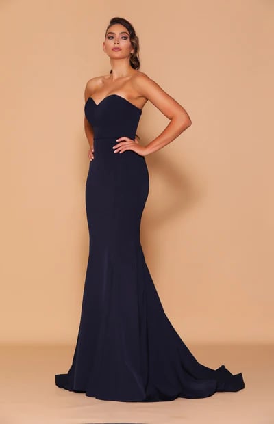 A stunning form-fitting, long, strapless mermaid-style gown, complete with a long back train.